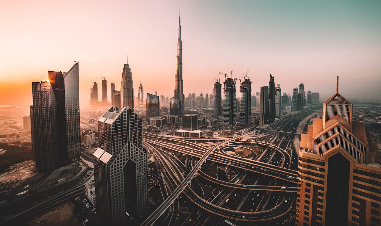 Dubaï — aerial photo of city highway surrounded by high-rise buildings