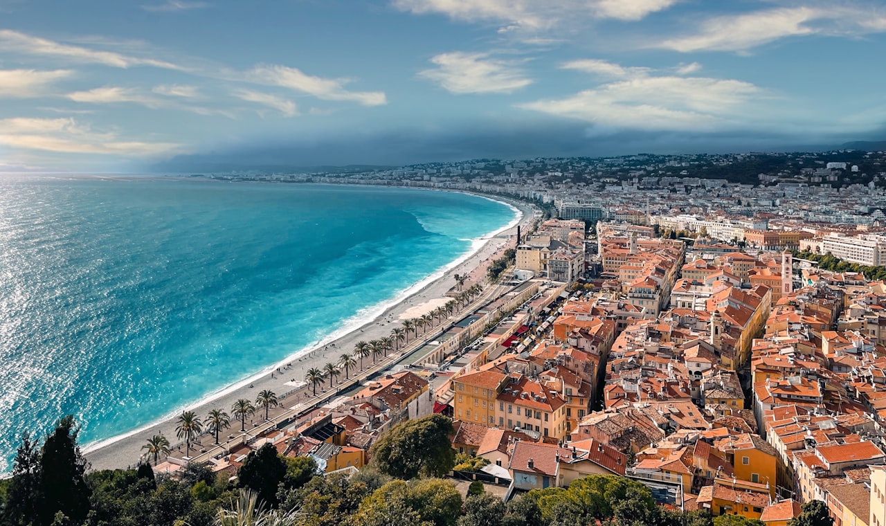 Nice — an aerial view of a city next to the ocean