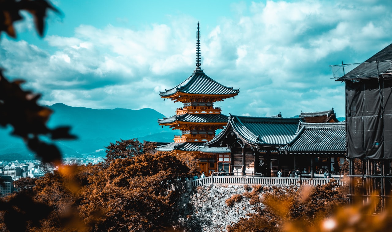 Kyoto — people near pagoda under white and blue sky